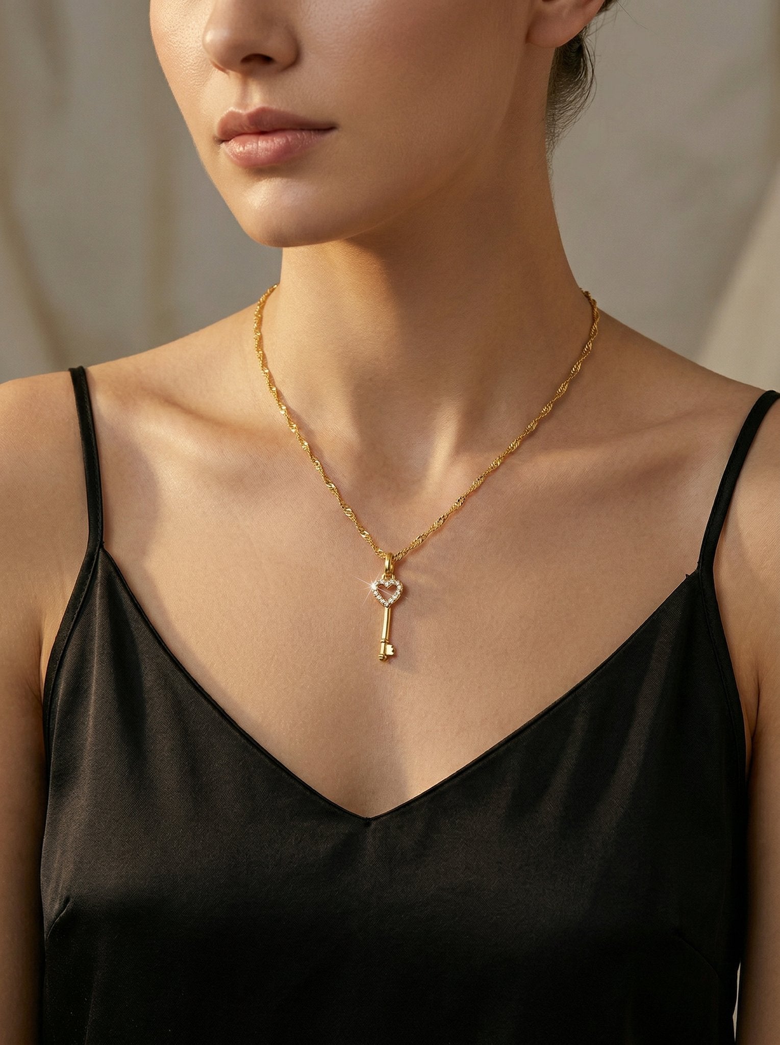 Love language jewelry gift - Woman wearing gold heart key pendant