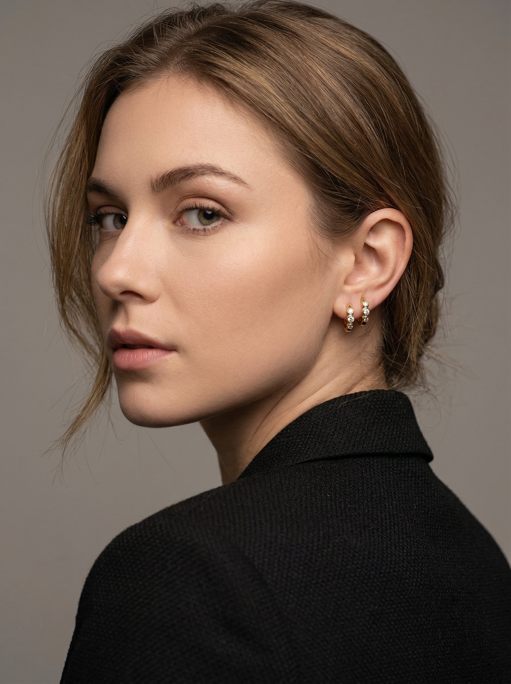 Model wearing gold huggie earrings — bachelorette party jewelry inspiration 2026