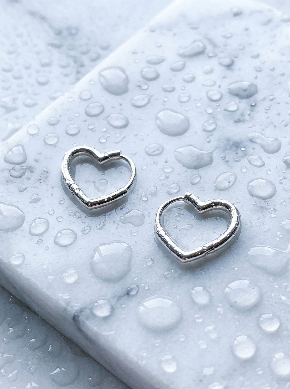 Lucite Jewelry Trend April 2026: How to Style Clear Gloss Layers This Season