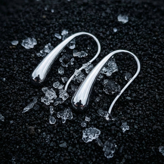Tassel-inspired movement jewelry trend in silver drop earrings