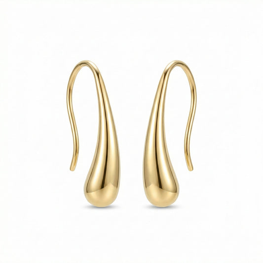 Woman wearing gold Deva Liquid Metal Water Drop Earrings — festival jewelry styling by HyraMode