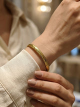 Model wearing the Gova Wide Herringbone Chain Bracelet showing the old money jewelry aesthetic