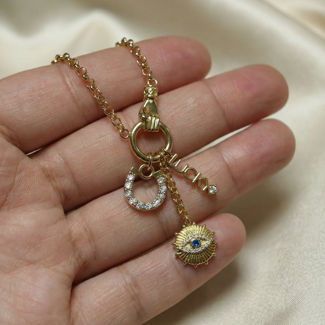 Bezel-inspired layered jewelry trend for April 2026