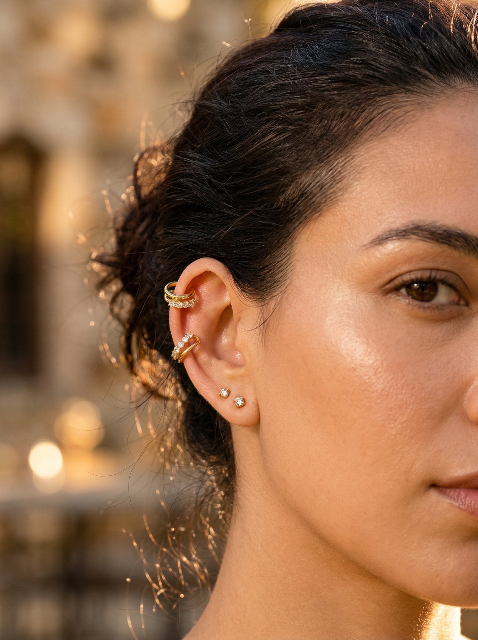 Model wearing the HyraMode Livo Ear Cuff in gold for a soft, everyday no-piercing ear stack