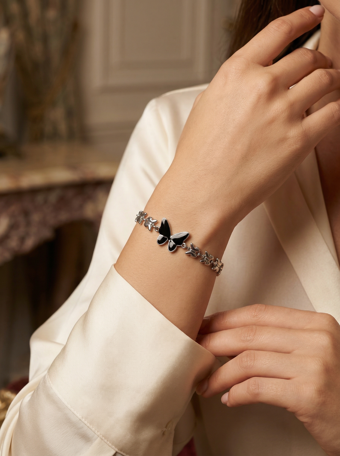 Model wearing Mavi Chain Butterfly Bracelet