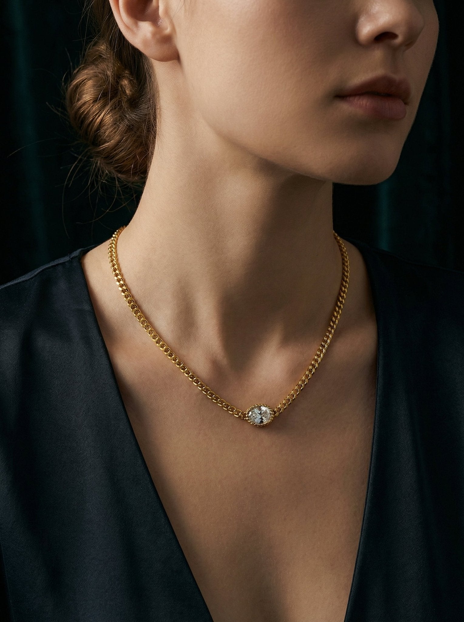 Model wearing a gold CZ pendant necklace from HyraMode — cubic zirconia jewelry that looks like real diamonds