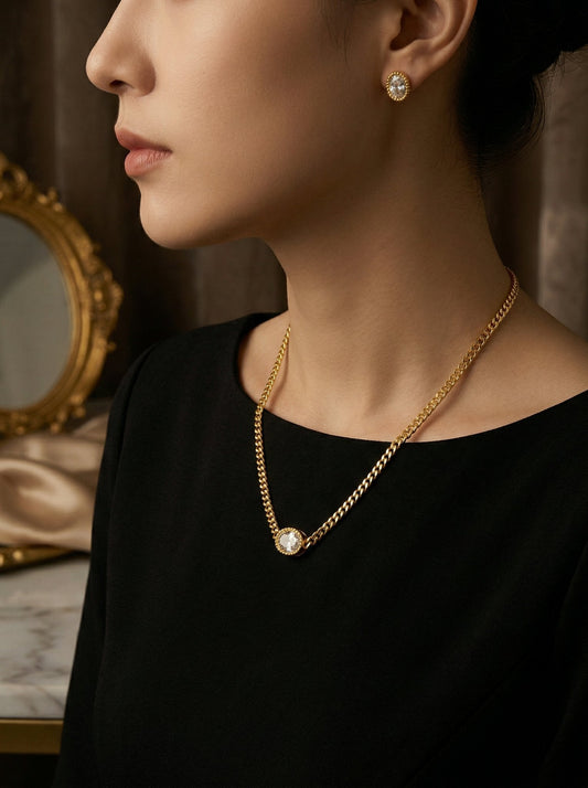 Woman wearing a dainty gold CZ pendant necklace styled for a day-to-night transition look