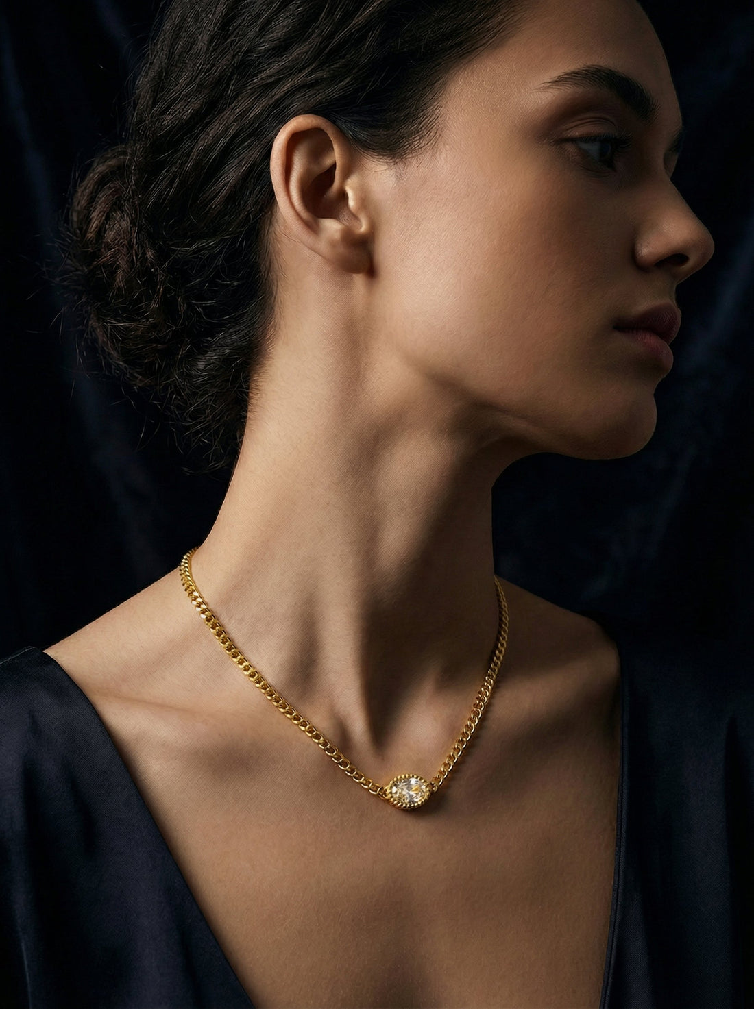 Model wearing Mevi Dainty CZ Pendant Necklace in gold, close-up portrait