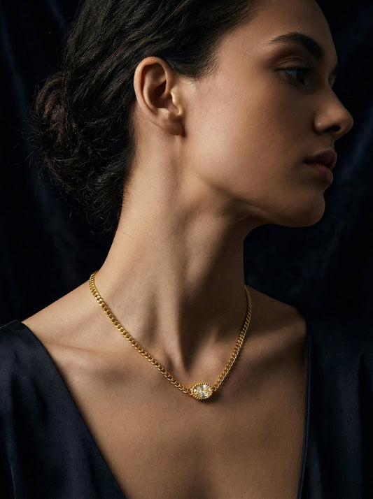 Model wearing Mevi Dainty CZ Pendant Necklace in gold, close-up portrait