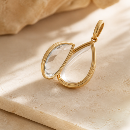 Open Aria Teardrop locket showing its clear hinged keepsake chamber