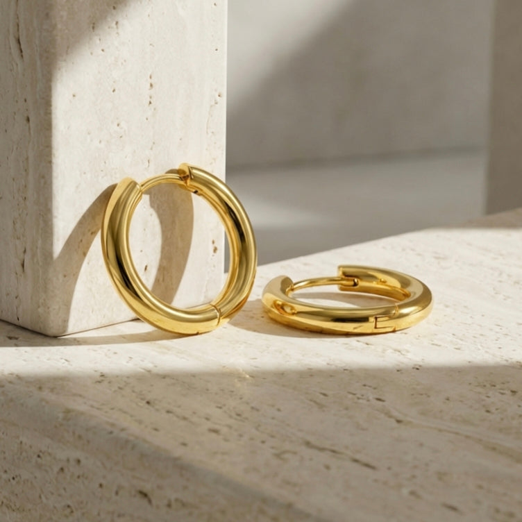 Aura Oval Hoop Earrings layered pendant styling image