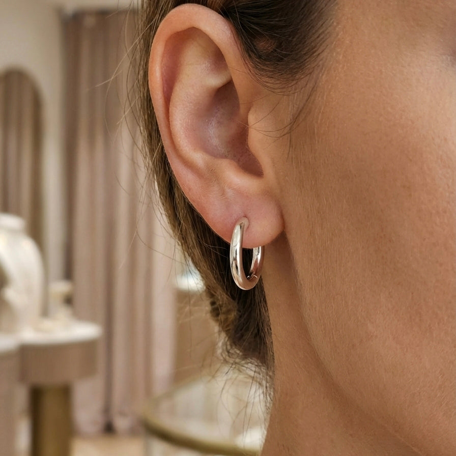 Aura Oval Hoop Earrings layered pendant styling image