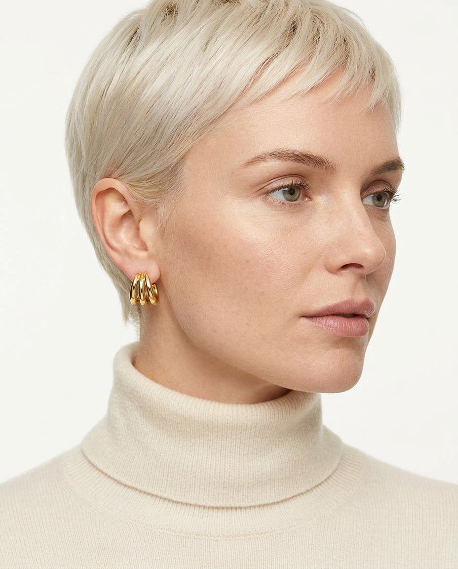 Tria Triple Hoop Stud Earrings in gold, on-ear view